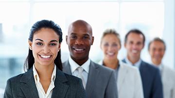 Professionals standing and smiling